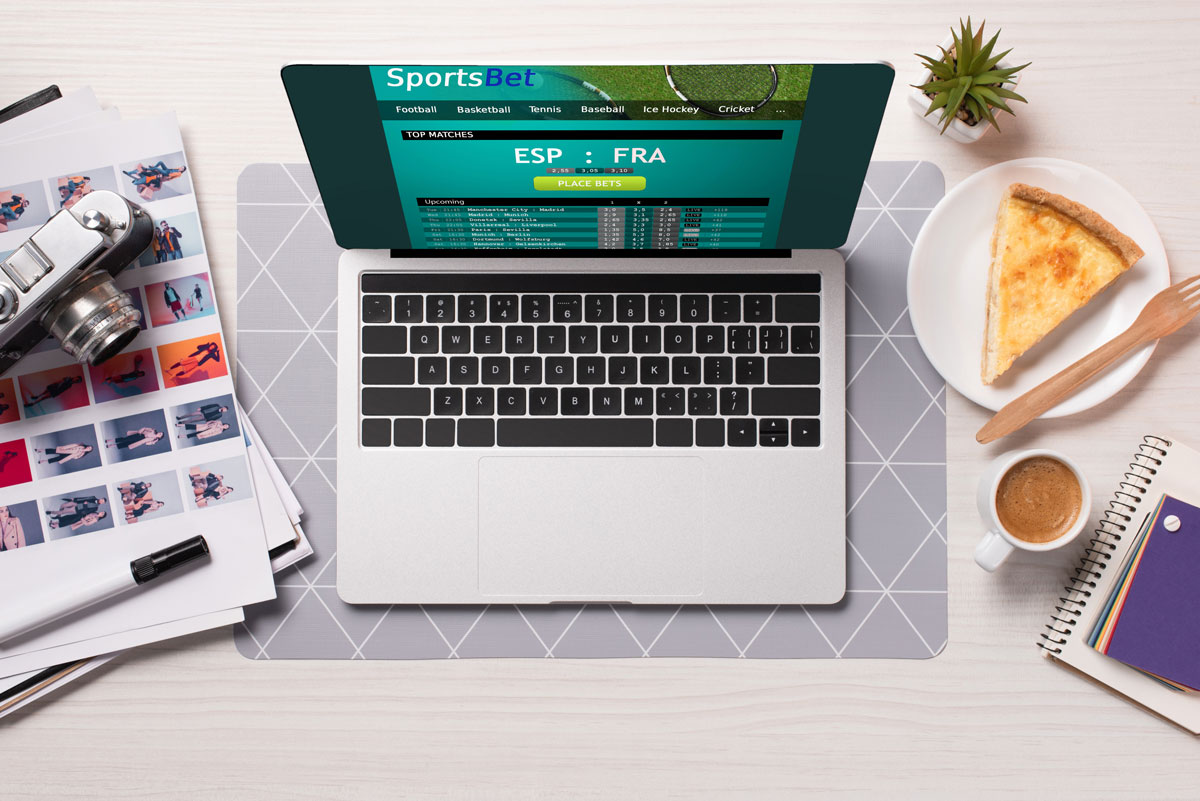 office-desk-with-laptop-with-sports-betting-website